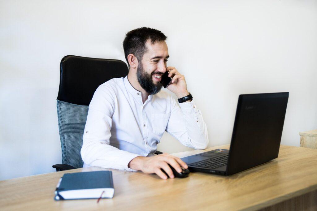 Towing company manager answering the phone and talking to a new lead